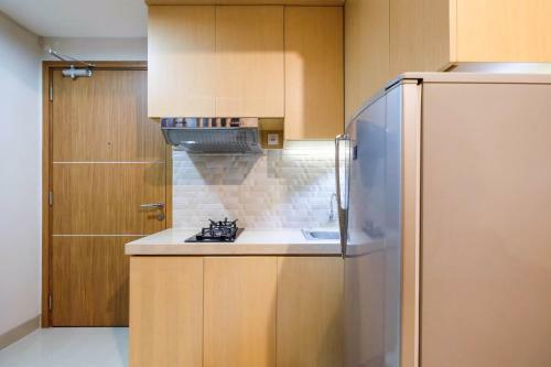 Comfortable 1br The Oasis Lippo Cikarang Apartment By Travelio