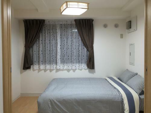 Apartamento Issyuku Hostel