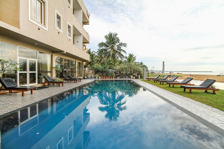 Hotel Capital O 311 Grace Beach Resort