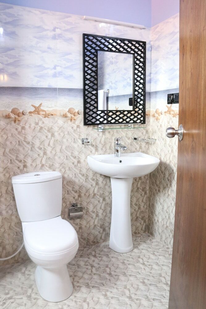 Hotel Capital O 311 Grace Beach Resort
