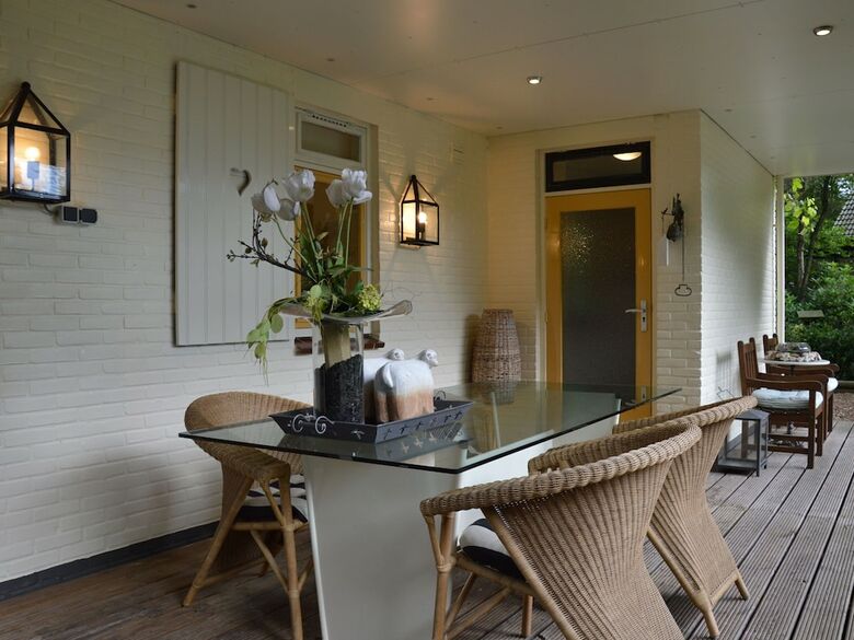 A Detached Bungalow With Outdoor Fireplace, Covered Terrace And Pond In A Forest Plot