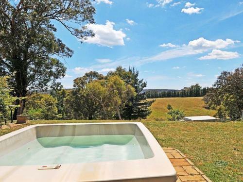 The Farmhouse - Grape Vines And Rolling Green Hills