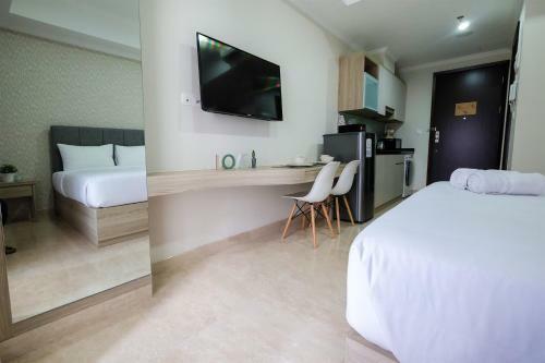 Minimalist Studio Menteng Park Apartment By Travelio