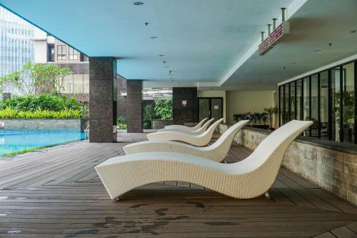 Cozy Studio At Tamansari Semanggi Apartment By Travelio