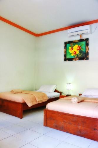 Hotel Taxa Inn Kuta Raya