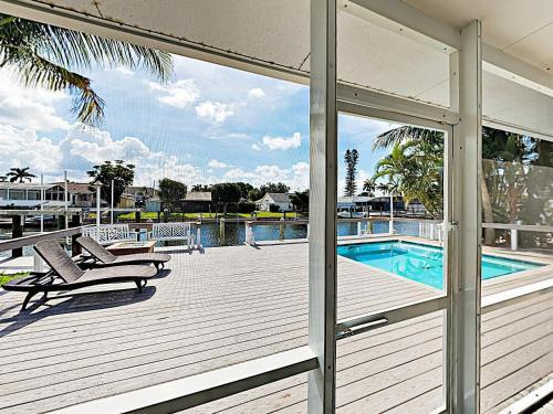 New Listing! Canal-front Oasis With Pool & Boat Dock Home