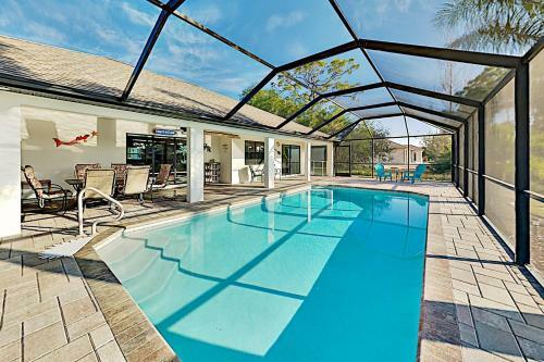 Canal-front Getaway - Boat Dock & Heated Pool Home