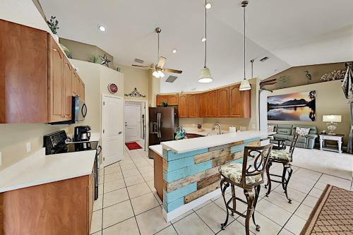 Canalfront Beauty With Private Heated Pool & Garage Home