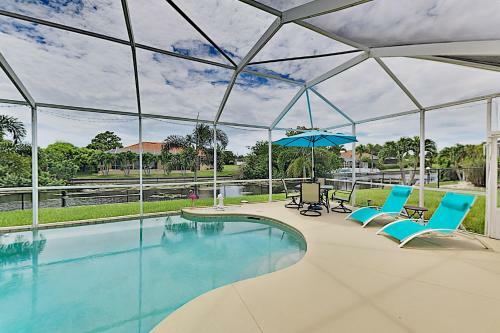 Canalfront Beauty With Private Heated Pool & Garage Home