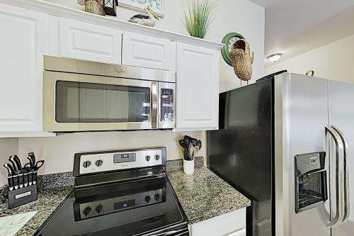 Poolside Beauty With Heated Pool - Steps To Beach Townhouse
