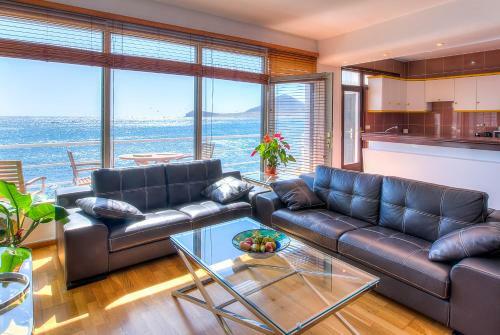 House Touching The Sea