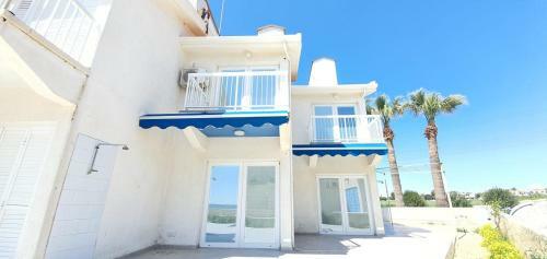Blue Beachfront House Next To Golden Bay Hotel