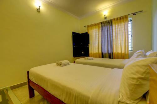 Hotel Ezzenza Royal Garden Brindavan Resort