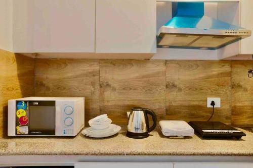 Apartamento The F�ilte Square Near India Expo Mart