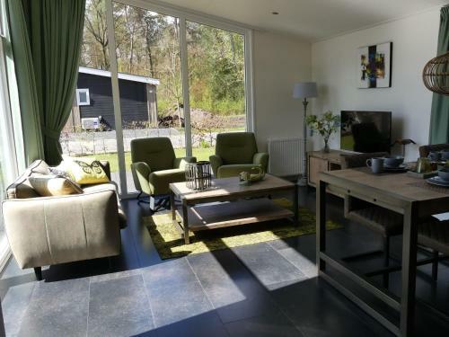 Modern Chalet With Outdoor Fireplace At The Forest