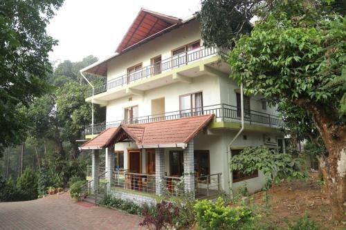 Hotel Whispering Woods By Aura Hospitality