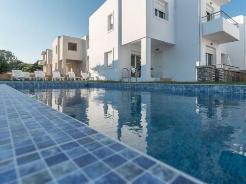 Posh Holiday Home In Gennadi With Shared Swimming Pool