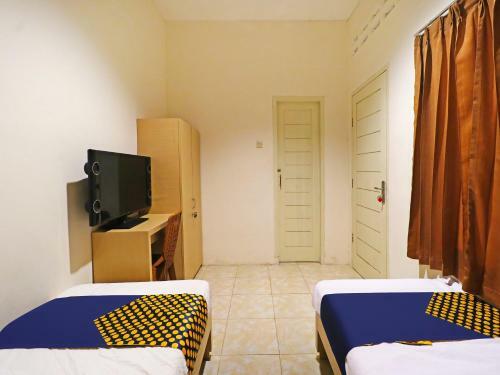 Hotel Spot On 91504 De Vila Ungu Syariah